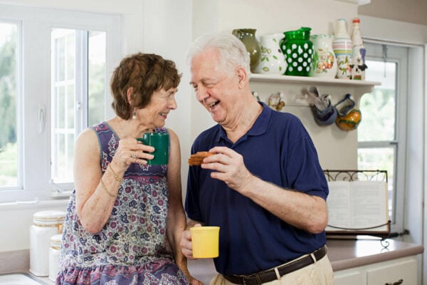senior couple having a hot drink at home