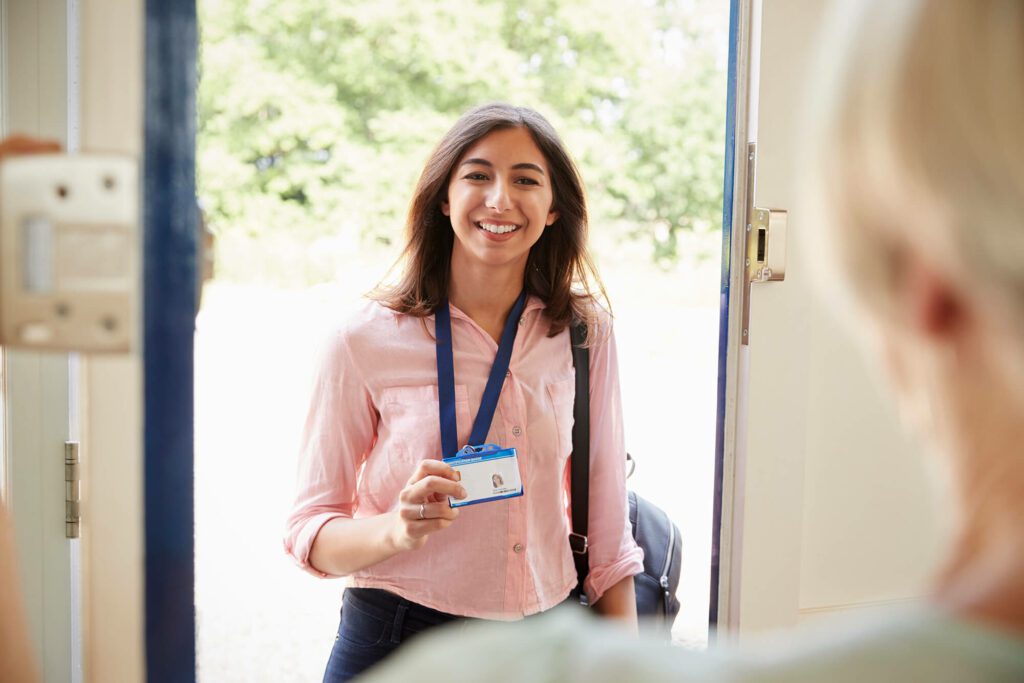 Carer visiting elderly person