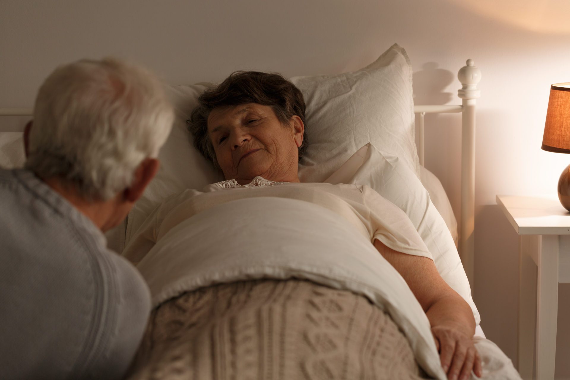 Senior woman in bed