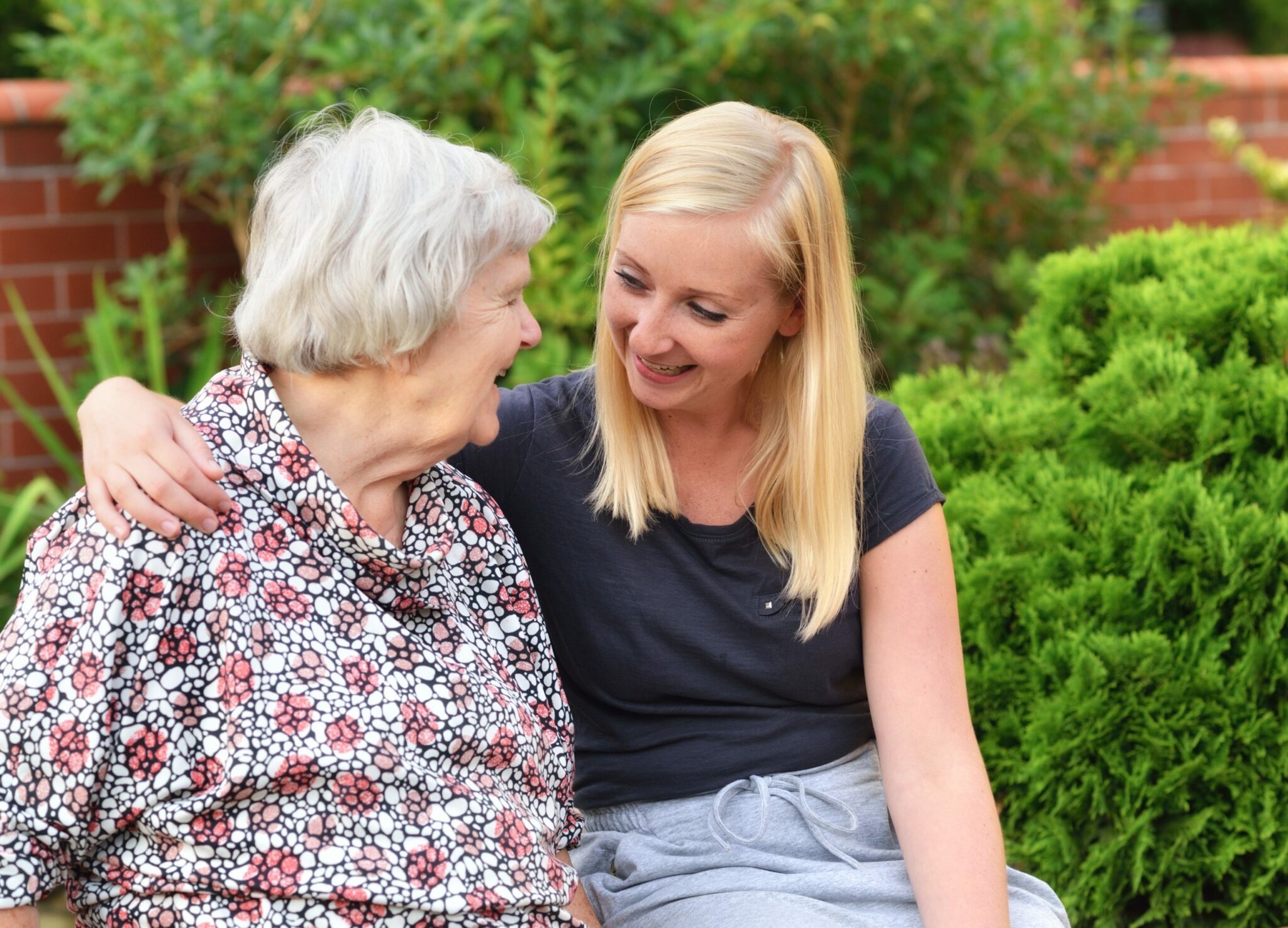 Carer with old woman affected by dementia