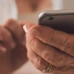 Senior person holding a phone