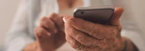 Senior person holding a phone